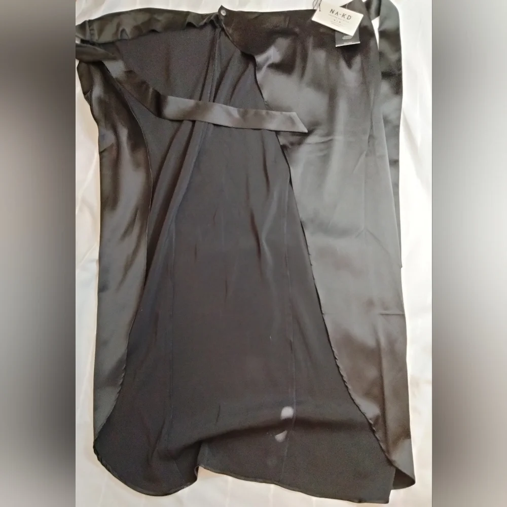 Gorgeous black wrap around skirt. New with tags! Size 34